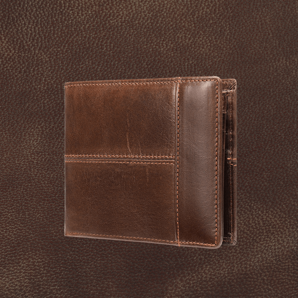 Brown leather wallet on a textured brown background