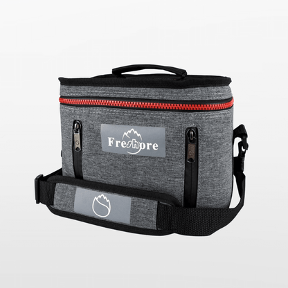 Gray cooler bag with red zipper and 'Freshore' branding on a light gray background