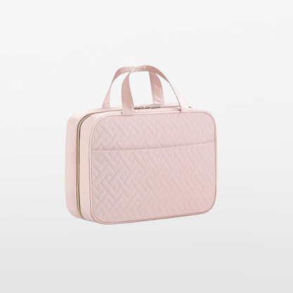 Pink quilted briefcase on a light gray background