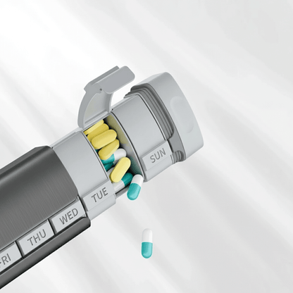 Weekly pill organizer with assorted pills on a light gray background