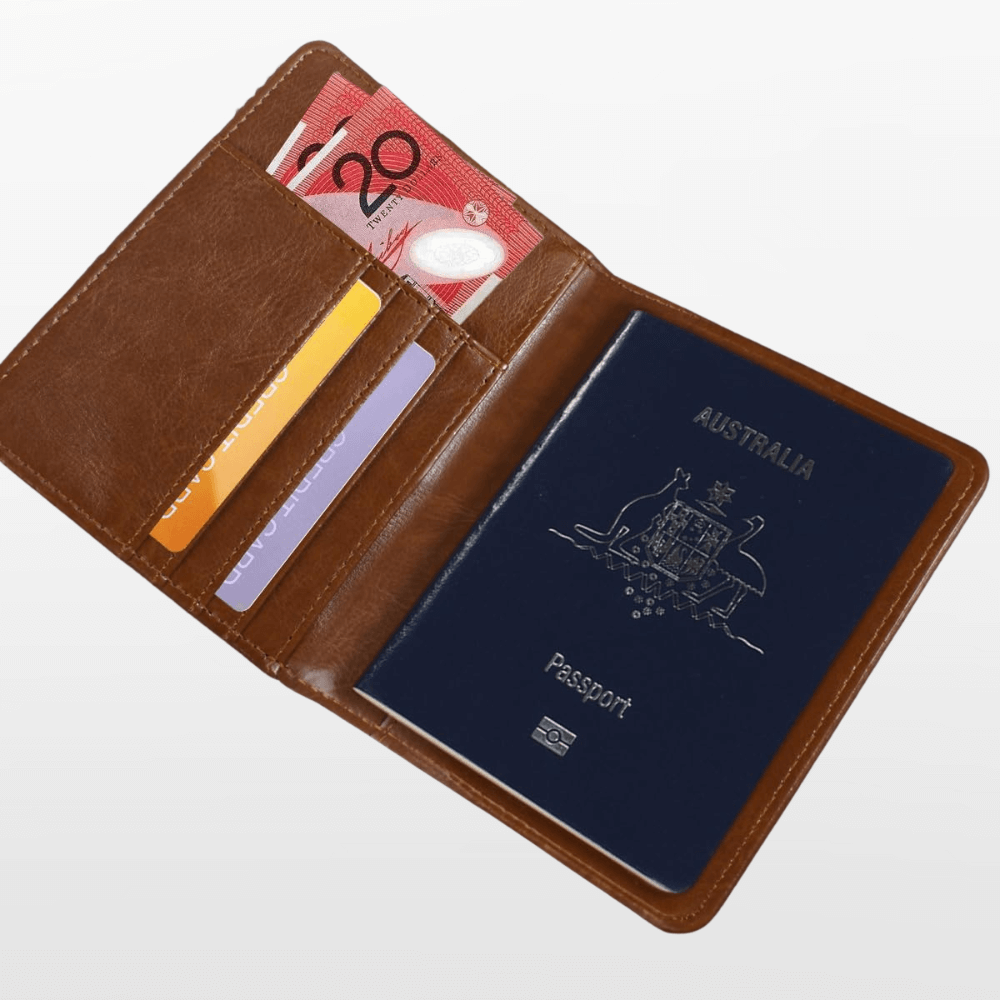 Brown leather wallet with Australian passport and money on a white background