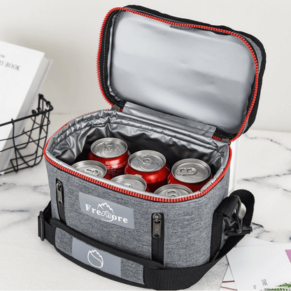 Gray cooler bag with red trim containing red and silver cans, branded 'Freshpre'.