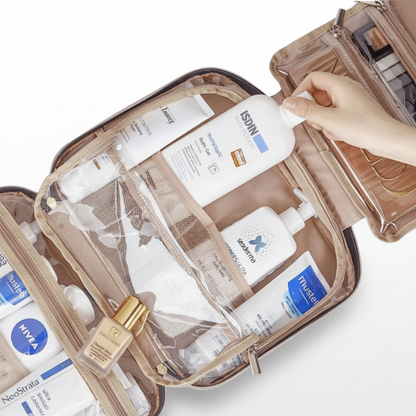 Cosmetic bag with skincare products and a hand holding a bottle of Isdin.